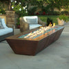 Close-up of the vibrant flames on the 10ft Copper Spartan Gas Fire Pit, showcasing the beautiful fire glass and hammered copper finish, perfect for outdoor ambiance