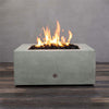 Front view of Starfire Designs Gravity 36" Square Rustic Gravity Concrete (GFRC) Fire Pit - Natural Gas - Natural Gray with flames on, featuring sleek modern concrete bowl design and durable construction, perfect for outdoor patio spaces. Natural gas or propane compatible, enhancing warmth and ambiance. Lava rocks included for added aesthetic.
