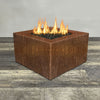 Front view of 36" Square Gravity Corten Steel Fire Pit by Starfire Designs - Brown with flames on, featuring sleek modern  design and durable construction, perfect for outdoor patio spaces. Natural gas or propane compatible, enhancing warmth and ambiance. Lava rocks included for added aesthetic.
