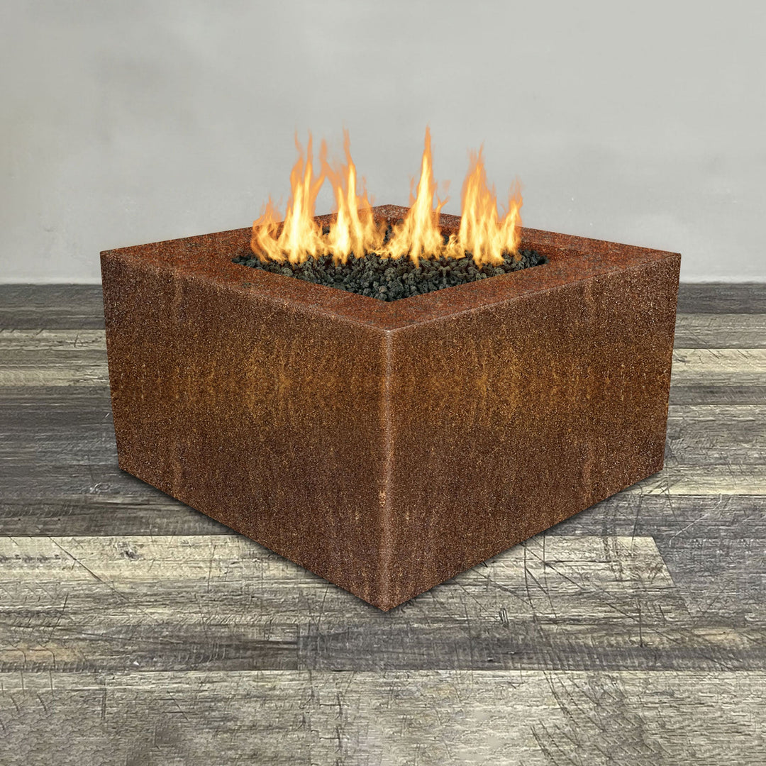 Front view of 36" Square Gravity Corten Steel Fire Pit by Starfire Designs - Brown with flames on, featuring sleek modern  design and durable construction, perfect for outdoor patio spaces. Natural gas or propane compatible, enhancing warmth and ambiance. Lava rocks included for added aesthetic.