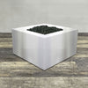 A side view of the 36" Square Gravity Stainless Steel Fire Pit by Starfire Designs - perfect for outdoor patio spaces. Natural gas or propane compatible, enhancing warmth and ambiance. Lava rocks included for added aesthetic.
