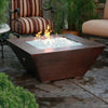 40-inch Copper Canyon gas fire pit by Starfire Designs, placed in an outdoor patio setting, with a hammered copper finish, enhancing your outdoor living space