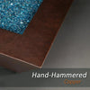 Close-up of the hand-hammered copper edge and blue fire glass of the Plaza Moreno 40" square fire pit, showcasing the detailed craftsmanship and premium materials used in this modern outdoor fire pit by Starfire Designs
