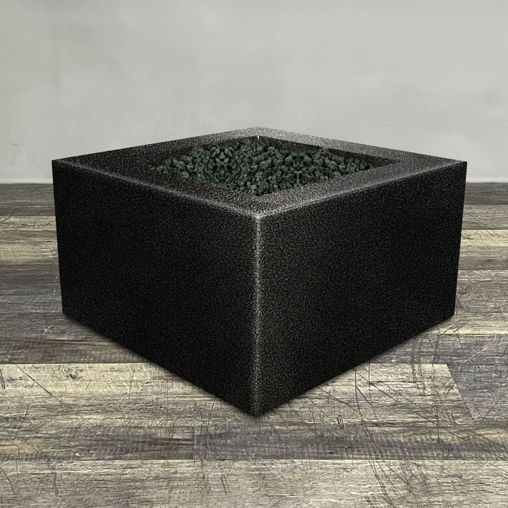 A side view of the 45" Square Gravity Powder Coated Steel Fire Pit - Natural Gas - 110V Electronic Ignition System - Silver Vein by Starfire Designs - perfect for outdoor patio spaces. Natural gas or propane compatible, enhancing warmth and ambiance. Lava rocks included for added aesthetic.