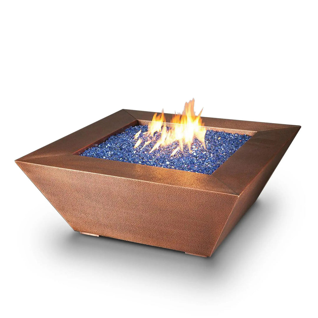 Starfire Designs 48-inch Copper Canyon gas fire pit with stunning blue fire glass, featuring a hammered copper finish, ideal for luxury outdoor fire pits