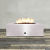 Front view of 48" x 24" Rectangle Gravity Powder Coated Steel Fire Pit - Propane Gas Hardline - 110V CSA Hi/Lo Electronic Ignition System w/Bluetooth & Handheld Remote - White Hammertone by Starfire Designs - Brown with flames on, featuring sleek modern concrete design and durable construction, perfect for outdoor patio spaces. Natural gas or propane compatible, enhancing warmth and ambiance. Lava rocks included for added aesthetic.