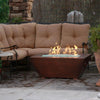 48" x 32" Copper Canyon gas fire pit by Starfire Designs, placed in a cozy outdoor seating area, with a hammered copper finish and elegant design, ideal for modern outdoor fire pits
