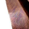 Close-up of the hand-hammered copper edge on the 50-inch Plaza Moreno copper fire pit, highlighting the unique craftsmanship of this luxury outdoor fire pit by Starfire Designs