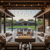 A covered rustic patio features a brown outdoor fire pit surrounded by armchairs and sofas. The setting overlooks a farmhouse lawn and swimming pool at twilight, with string lights adding to the ambiance. The warm glow of the fire table creates a cozy backyard fire pit atmosphere, utilizing a gas fire pit connection for convenience.