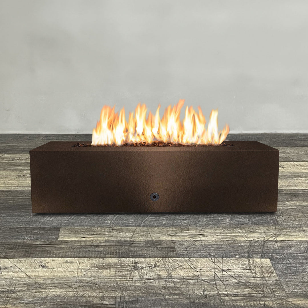 Front view of 60" x 32" Rectangle Gravity Powder Coated Steel Fire Pit - Propane Gas Hardline - Push Button Spark Ignition - Bronze Hammertone by Starfire Designs - Brown with flames on, featuring sleek modern concrete design and durable construction, perfect for outdoor patio spaces. Natural gas or propane compatible, enhancing warmth and ambiance. Lava rocks included for added aesthetic.