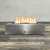 Front view of 60" x 32" Rectangle Gravity Powder Coated Steel Fire Pit - Natural Gas - Flame Sense with Spark Ignition System - Silver Hammertone by Starfire Designs - Brown with flames on, featuring sleek modern concrete design and durable construction, perfect for outdoor patio spaces. Natural gas or propane compatible, enhancing warmth and ambiance. Lava rocks included for added aesthetic.
