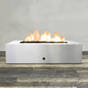 Front view of 60" x 32" Rectangle Gravity Stainless Steel Fire Pit by Starfire Designs - Brown with flames on, featuring sleek modern  design and durable construction, perfect for outdoor patio spaces. Natural gas or propane compatible, enhancing warmth and ambiance. Lava rocks included for added aesthetic.
