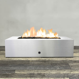 Front view of 60" x 32" Rectangle Gravity Stainless Steel Fire Pit by Starfire Designs - Brown with flames on, featuring sleek modern  design and durable construction, perfect for outdoor patio spaces. Natural gas or propane compatible, enhancing warmth and ambiance. Lava rocks included for added aesthetic.
