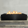 Front view of 72" x 38" Rectangle Gravity Powder Coated Steel Fire Pit - Propane Gas Hardline - 110V CSA Hi/Lo Electronic Ignition System w/Bluetooth & Handheld Remote - Black Hammertone by Starfire Designs - Brown with flames on, featuring sleek modern concrete design and durable construction, perfect for outdoor patio spaces. Natural gas or propane compatible, enhancing warmth and ambiance. Lava rocks included for added aesthetic.
