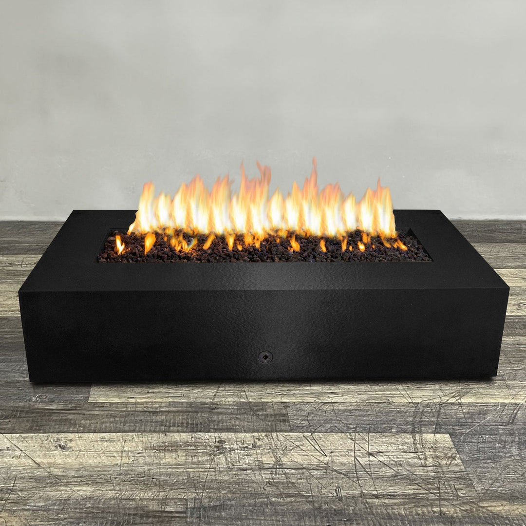 A side view of the 72" x 38" Rectangle Gravity Powder Coated Steel Fire Pit - Propane Gas Hardline - 110V CSA Hi/Lo Electronic Ignition System w/Bluetooth & Handheld Remote - Black Hammertone by Starfire Designs - perfect for outdoor patio spaces. Natural gas or propane compatible, enhancing warmth and ambiance. Lava rocks included for added aesthetic.
