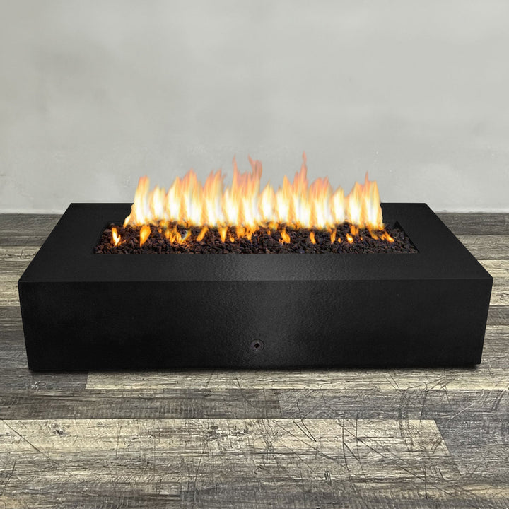 A side view of the 72" x 38" Rectangle Gravity Powder Coated Steel Fire Pit - Propane Gas Hardline - 110V CSA Hi/Lo Electronic Ignition System w/Bluetooth & Handheld Remote - Black Hammertone by Starfire Designs - perfect for outdoor patio spaces. Natural gas or propane compatible, enhancing warmth and ambiance. Lava rocks included for added aesthetic.