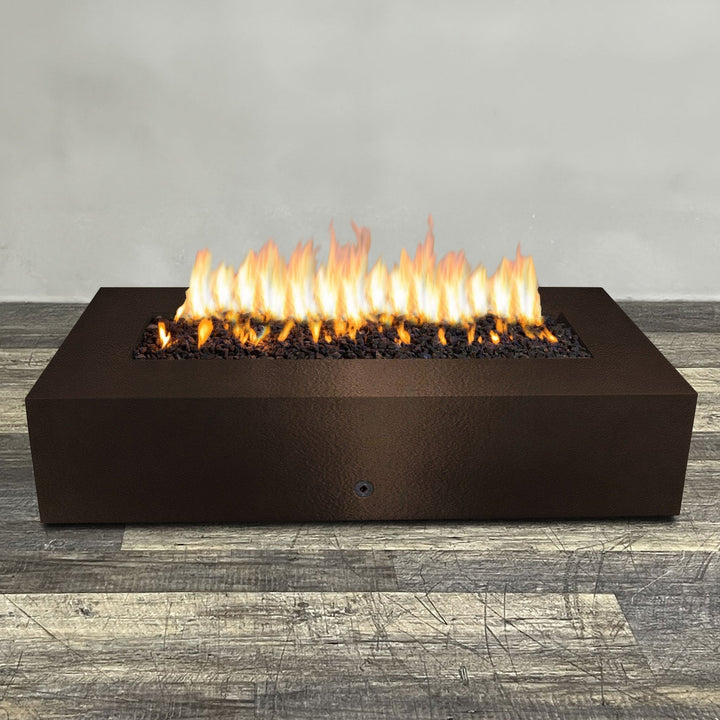 A side view of the 72" x 38" Rectangle Gravity Powder Coated Steel Fire Pit - Propane Gas Hardline - 110V CSA Hi/Lo Electronic Ignition System w/Bluetooth & Handheld Remote - Bronze Hammertone by Starfire Designs - perfect for outdoor patio spaces. Natural gas or propane compatible, enhancing warmth and ambiance. Lava rocks included for added aesthetic.