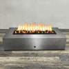 A side view of the 72" x 38" Rectangle Gravity Powder Coated Steel Fire Pit - Propane Gas Hardline - 110V CSA Hi/Lo Electronic Ignition System w/Bluetooth & Handheld Remote - Silver Hammertone by Starfire Designs - perfect for outdoor patio spaces. Natural gas or propane compatible, enhancing warmth and ambiance. Lava rocks included for added aesthetic.