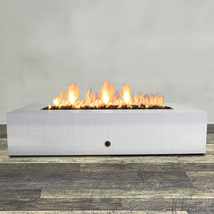 Front view of 72" x 38" Rectangle Gravity Stainless Steel Fire Pit - Natural Gas - Match Lit by Starfire Designs - Brown with flames on, featuring sleek modern  design and durable construction, perfect for outdoor patio spaces. Natural gas or propane compatible, enhancing warmth and ambiance. Lava rocks included for added aesthetic.
