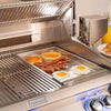 A Fire Magic Stainless Steel Griddle for A83, A54, C54, A43, C43 Grills, Power Burners, and Double Searing Stations showcases it's grilling potential isnide the Fire Magic grill
