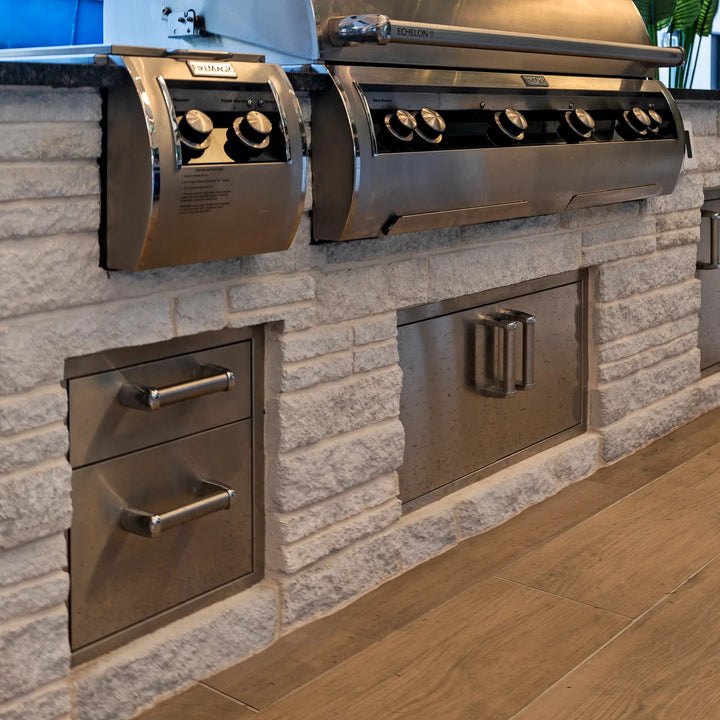Fire Magic Premium Double Drawer installed into an outdoor kitchen beneath a huge bbq and grill setup with side burner