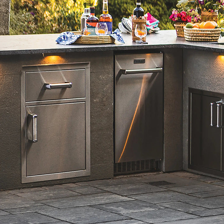 Fire Magic Premium Large Pantry Door and Drawer Combo installed into the counter of a modern outdoor kitchen setup