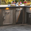Fire Magic Premium Medium Pantry Door and Drawer Combo installed beneath a stunning countertop in an outdoor kitchen setup.