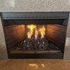 Modern gas fireplace featuring dark brick tiles and a unique arrangement of spherical ceramic fireballs, with flames dancing above reflective fire glass