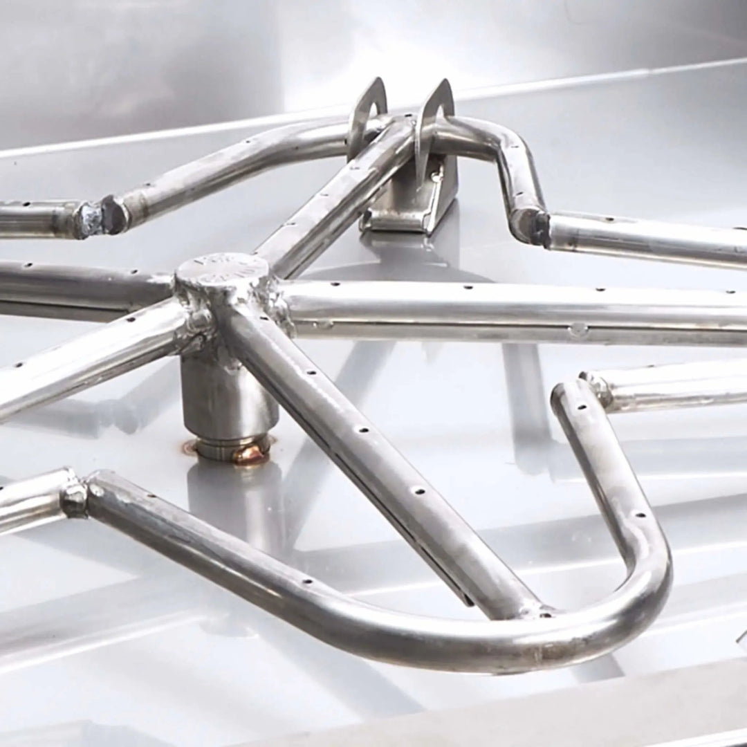 Detailed view of the Penta burner ring within the square drop-in pan by HPC Fire, showcasing its star-shaped design engineered for optimal flame distribution and enhanced visual appeal—crafted from 304 stainless steel for lasting performance.