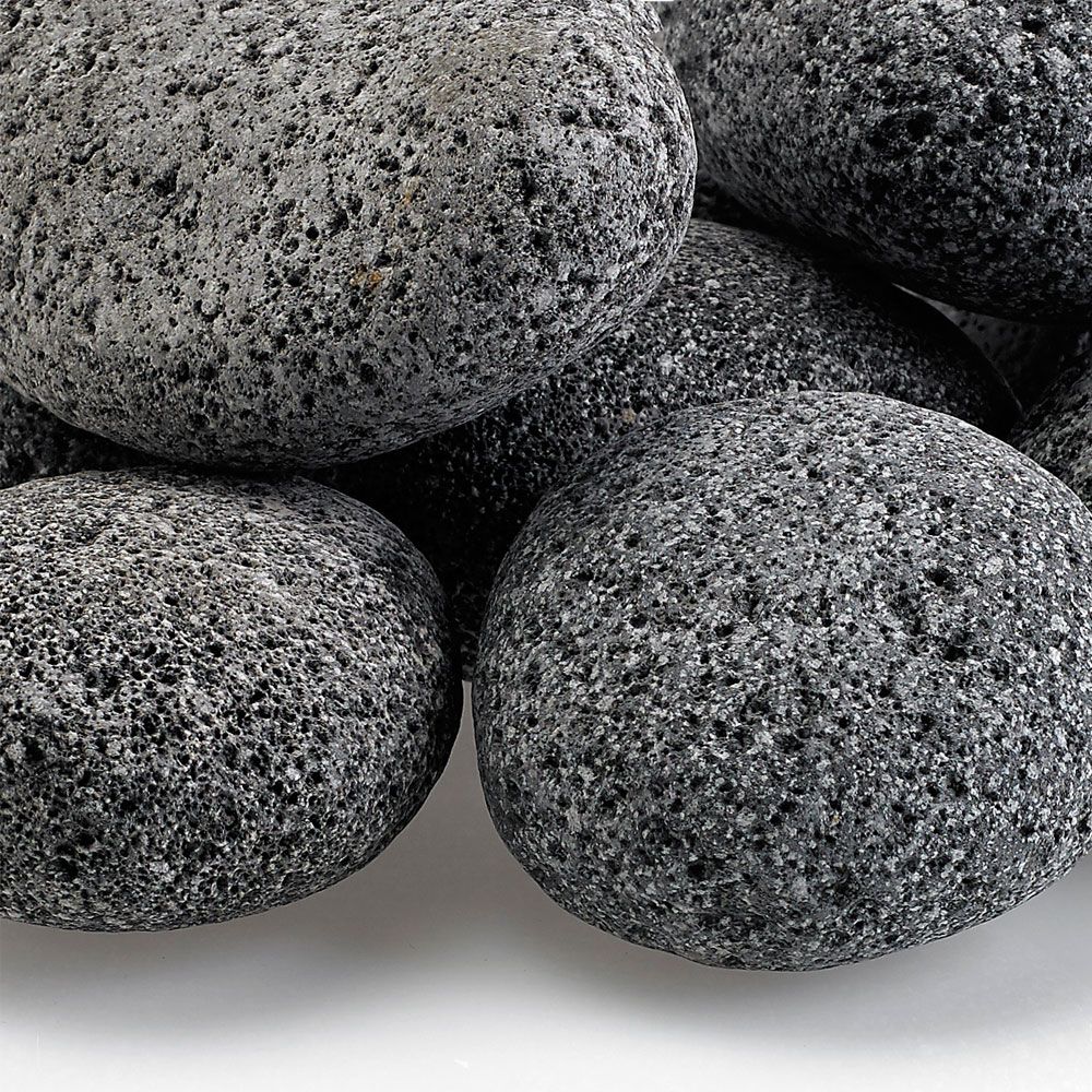 Close-up view of American Fire Products large gray lava stones, featuring porous texture and natural finish—perfect for enhancing gas fire pits with style and heat durability.
