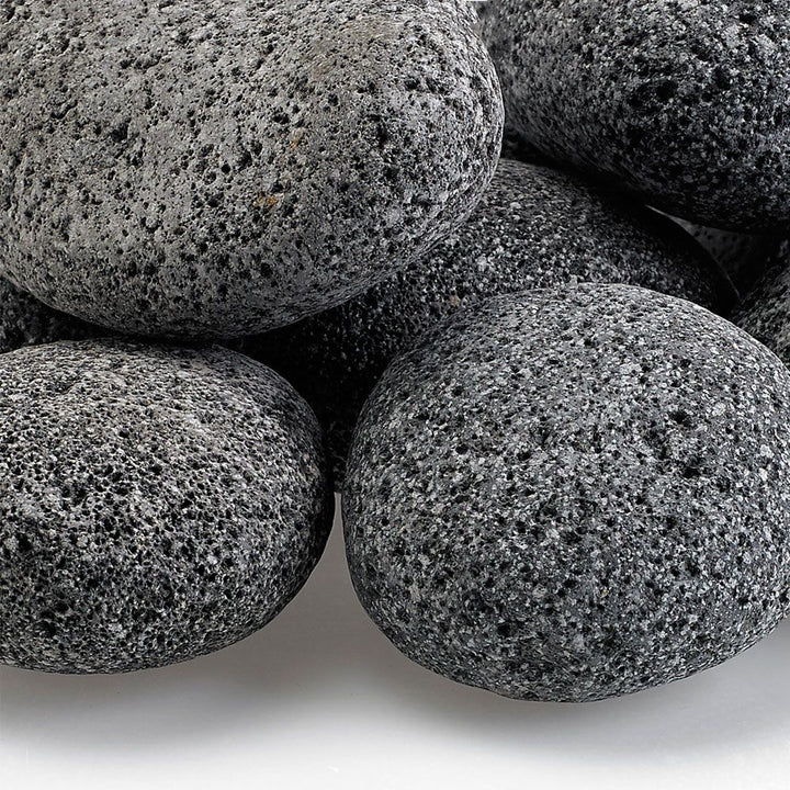 Close-up view of American Fire Products large gray lava stones, featuring porous texture and natural finish—perfect for enhancing gas fire pits with style and heat durability.