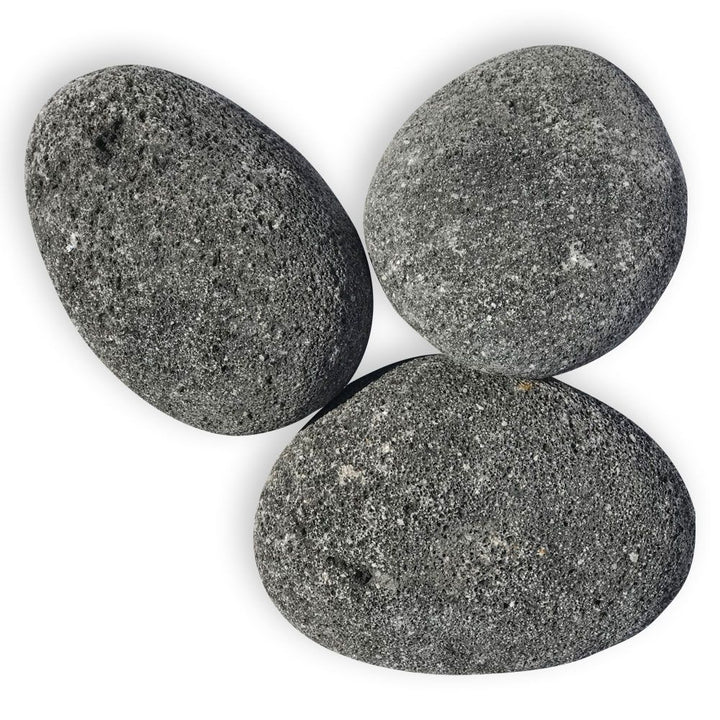 Three large, smooth-surfaced black lava stones from the XL collection by Starfire Direct—perfect for enhancing the look of fire pits or fireplaces with natural texture and lasting heat resistance.