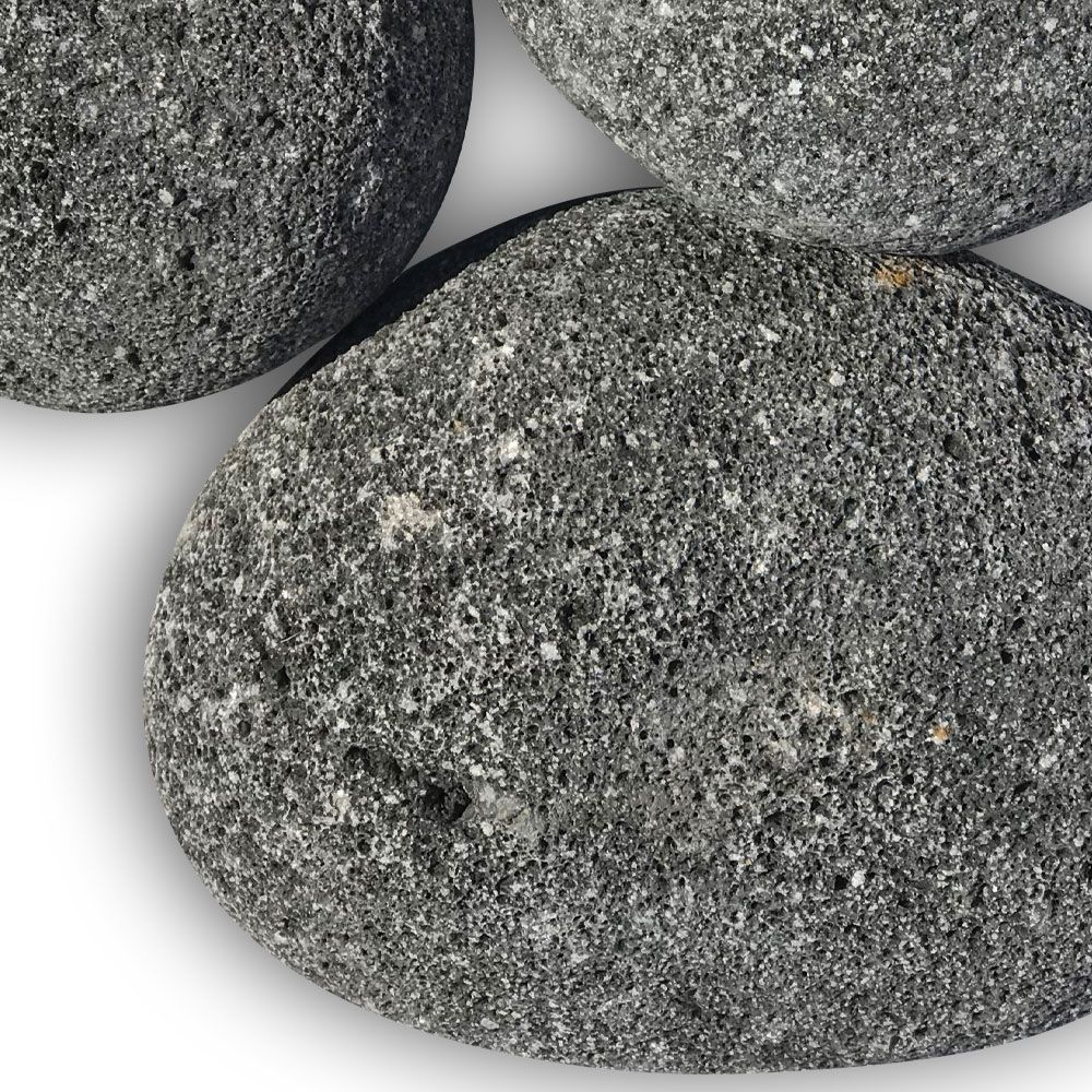 Close-up of extra-large black lava stones featuring a naturally rough, porous texture—ideal for bold, modern fire pit designs and superior heat performance.