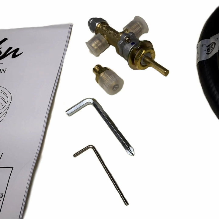 Close-up of Béton Fire Pit Natural Gas to Propane Conversion Kit components including brass valve, orifice fittings, and installation tools.