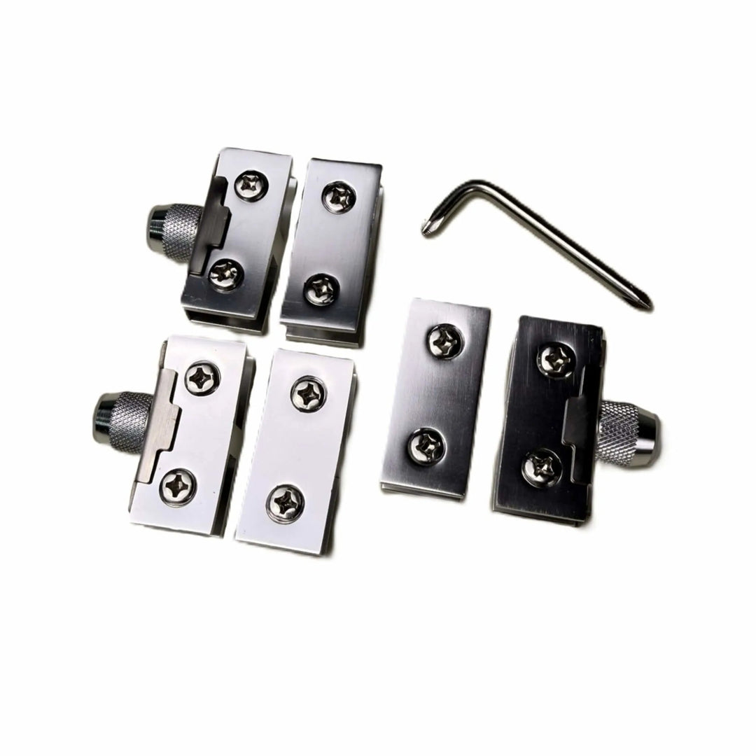 Top-down view of the Starfire Designs Béton Fire Pit Round Glass Guard Clips Kit featuring precision-cut stainless steel clips, mounting screws, and a tightening wrench for easy setup.