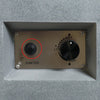 Installed Starfire Designs Béton Fire Pit Spark Button on the control panel, circled to highlight its placement next to the flame control knob for convenient ignition.
