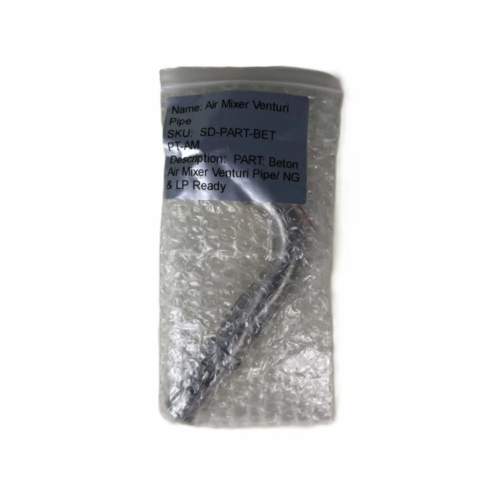 Starfire Designs Béton Fire Pit Venturi Pipe packaged in protective bubble wrap, labeled as ready for both propane and natural gas use.