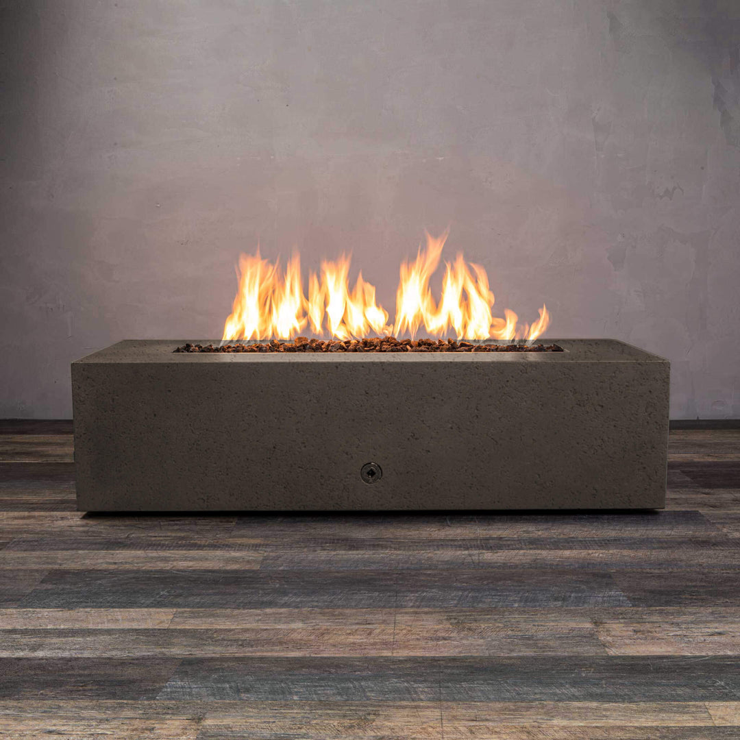 Front view of Starfire Designs Gravity 60" x 32" Rectangle Rustic Gravity Concrete (GFRC) Fire Pit - Propane Gas Hardline - Brown with flames on, featuring sleek modern concrete bowl design and durable construction, perfect for outdoor patio spaces. Natural gas or propane compatible, enhancing warmth and ambiance. Lava rocks included for added aesthetic.
