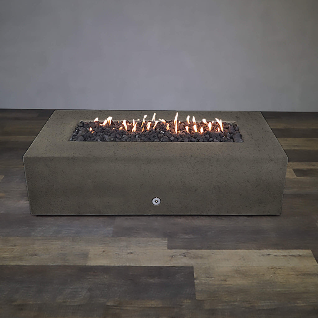 Front view of Starfire Designs Gravity 72" x 38" Rectangle Rustic Gravity Concrete (GFRC) Fire Pit - Propane Gas Hardline - Brown with flames on, featuring sleek modern concrete bowl design and durable construction, perfect for outdoor patio spaces. Natural gas or propane compatible, enhancing warmth and ambiance. Lava rocks included for added aesthetic.
