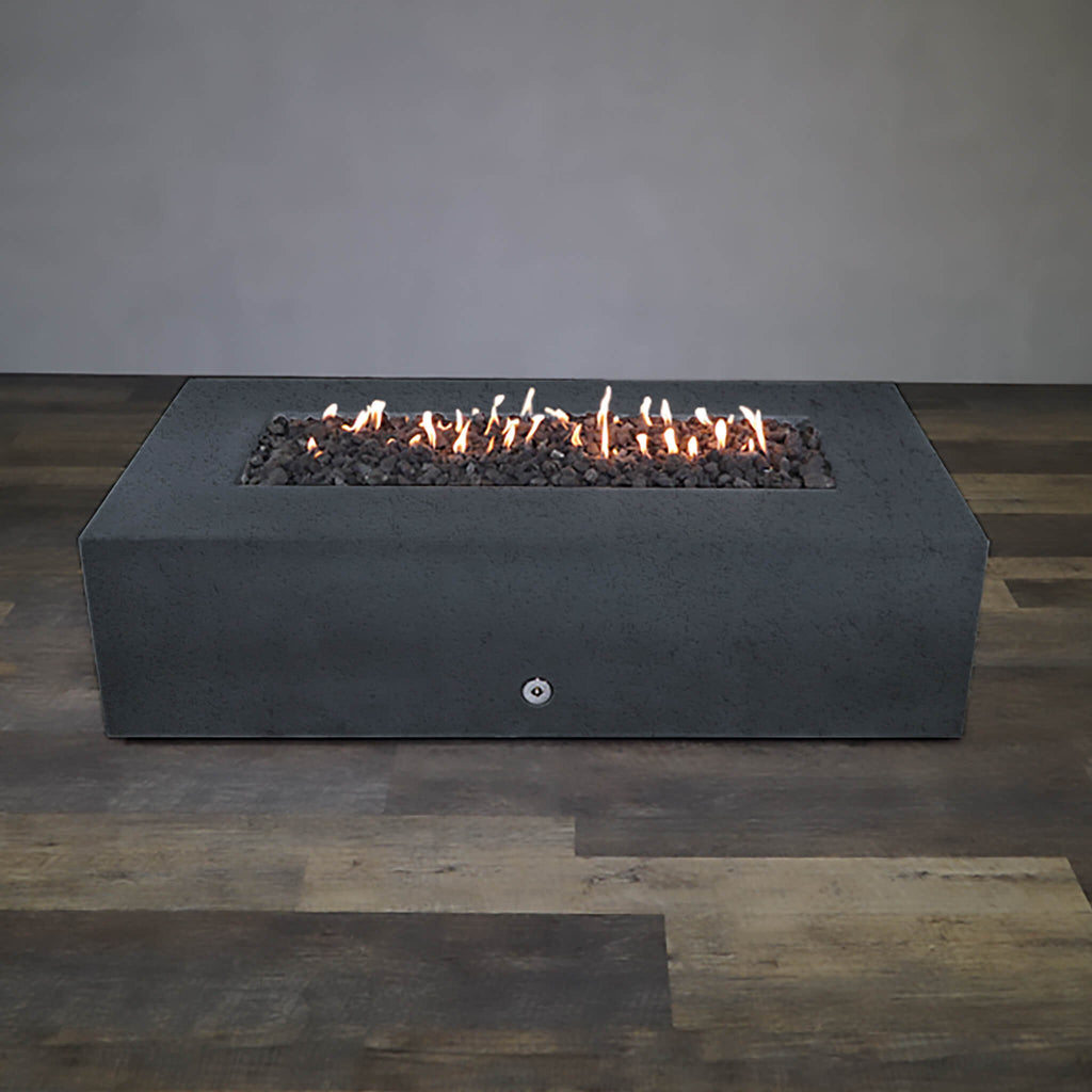 Front view of Starfire Designs Gravity 72" x 38" Rectangle Rustic Gravity Concrete (GFRC) Fire Pit - Propane Gas Hardline - Graphite with flames on, featuring sleek modern concrete bowl design and durable construction, perfect for outdoor patio spaces. Natural gas or propane compatible, enhancing warmth and ambiance. Lava rocks included for added aesthetic.