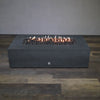 Front view of Starfire Designs Gravity 72" x 38" Rectangle Rustic Gravity Concrete (GFRC) Fire Pit - Propane Gas Hardline - Graphite with flames on, featuring sleek modern concrete bowl design and durable construction, perfect for outdoor patio spaces. Natural gas or propane compatible, enhancing warmth and ambiance. Lava rocks included for added aesthetic.