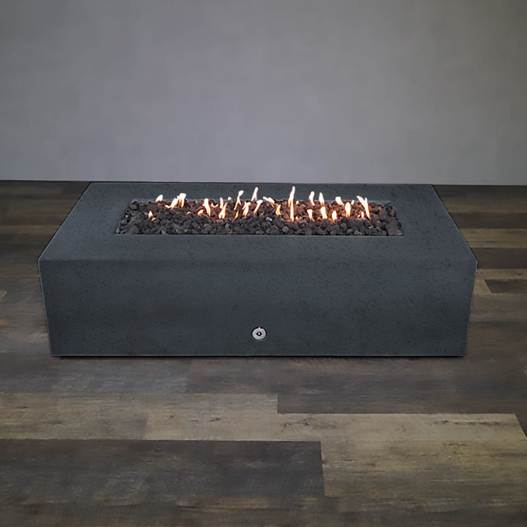 Front view of Starfire Designs Gravity 72" x 38" Rectangle Rustic Gravity Concrete (GFRC) Fire Pit - Propane Gas Hardline - Graphite with flames on, featuring sleek modern concrete bowl design and durable construction, perfect for outdoor patio spaces. Natural gas or propane compatible, enhancing warmth and ambiance. Lava rocks included for added aesthetic.