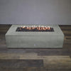 Front view of Starfire Designs Gravity 72" x 38" Rectangle Rustic Gravity Concrete (GFRC) Fire Pit - Propane Gas Hardline - Natural Gray with flames on, featuring sleek modern concrete bowl design and durable construction, perfect for outdoor patio spaces. Natural gas or propane compatible, enhancing warmth and ambiance. Lava rocks included for added aesthetic.