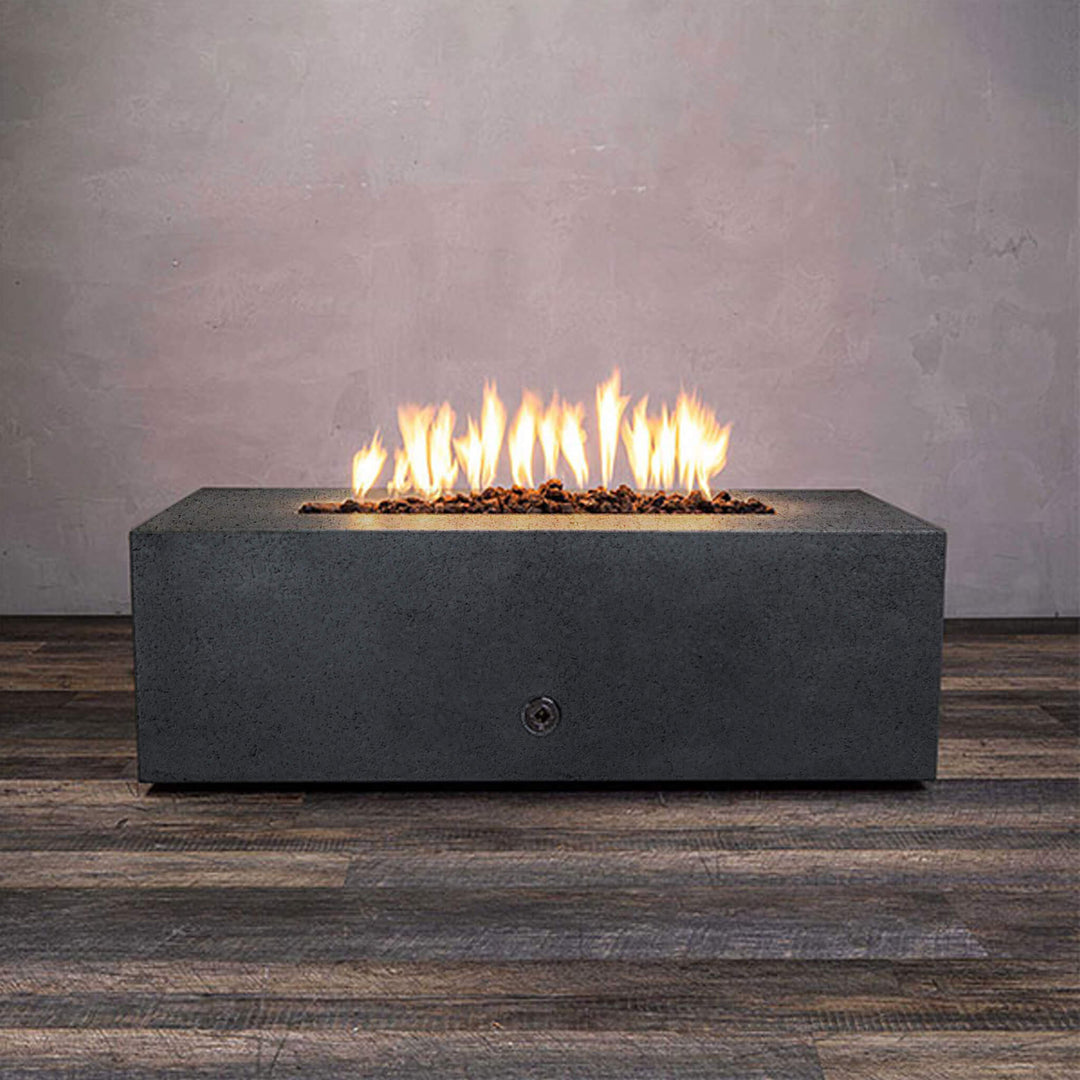 Front view of Starfire Designs Gravity 48" x 32" Rectangle Rustic Gravity Concrete (GFRC) Fire Pit - Propane Gas Hardline - Graphite with flames on, featuring sleek modern concrete bowl design and durable construction, perfect for outdoor patio spaces. Natural gas or propane compatible, enhancing warmth and ambiance. Lava rocks included for added aesthetic.
