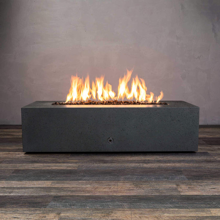 Front view of Starfire Designs Gravity 60" x 32" Rectangle Rustic Gravity Concrete (GFRC) Fire Pit - Propane Gas Hardline - Graphite with flames on, featuring sleek modern concrete bowl design and durable construction, perfect for outdoor patio spaces. Natural gas or propane compatible, enhancing warmth and ambiance. Lava rocks included for added aesthetic.
