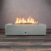 Front view of Starfire Designs Gravity 60" x 32" Rectangle Rustic Gravity Concrete (GFRC) Fire Pit - Propane Gas Hardline - Natural Gray with flames on, featuring sleek modern concrete bowl design and durable construction, perfect for outdoor patio spaces. Natural gas or propane compatible, enhancing warmth and ambiance. Lava rocks included for added aesthetic.
