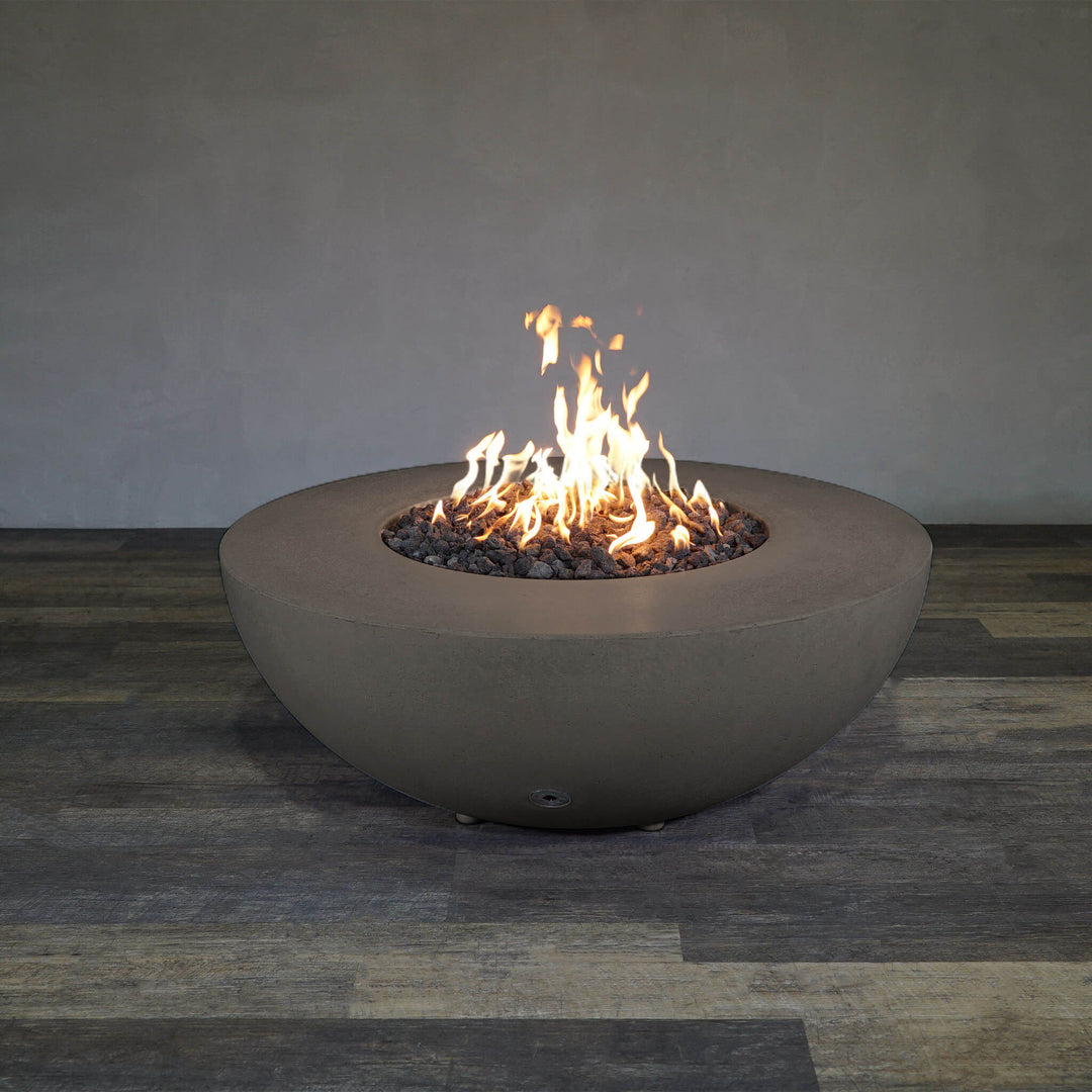 Front view of Starfire Designs Gravity 45" Round Rustic Gravity Concrete (GFRC) Fire Pit - Propane Gas Hardline - Brown with flames on, featuring sleek modern concrete bowl design and durable construction, perfect for outdoor patio spaces. Natural gas or propane compatible, enhancing warmth and ambiance. Lava rocks included for added aesthetic.
