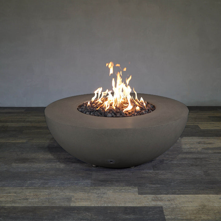 Front view of Starfire Designs Gravity 45" Round Rustic Gravity Concrete (GFRC) Fire Pit - Propane Gas Hardline - Brown with flames on, featuring sleek modern concrete bowl design and durable construction, perfect for outdoor patio spaces. Natural gas or propane compatible, enhancing warmth and ambiance. Lava rocks included for added aesthetic.
