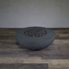 A side view of the Starfire Designs Gravity 45" Round Rustic Gravity Concrete (GFRC) Fire Pit - Propane Gas Hardline - Graphite with flames on, featuring sleek modern concrete bowl design and durable construction, perfect for outdoor patio spaces. Natural gas or propane compatible, enhancing warmth and ambiance. Lava rocks included for added aesthetic.
