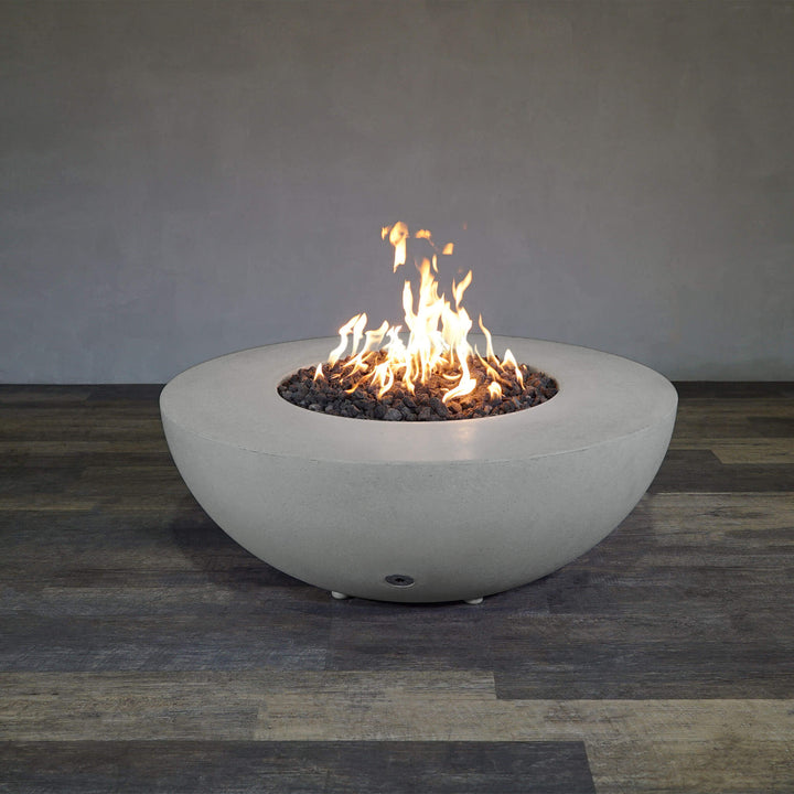 Front view of Starfire Designs Gravity 45" Round Rustic Gravity Concrete (GFRC) Fire Pit - Propane Gas Hardline - Natural Gray with flames on, featuring sleek modern concrete bowl design and durable construction, perfect for outdoor patio spaces. Natural gas or propane compatible, enhancing warmth and ambiance. Lava rocks included for added aesthetic.
